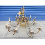 A large and impressive 12 branch brass chandelier.