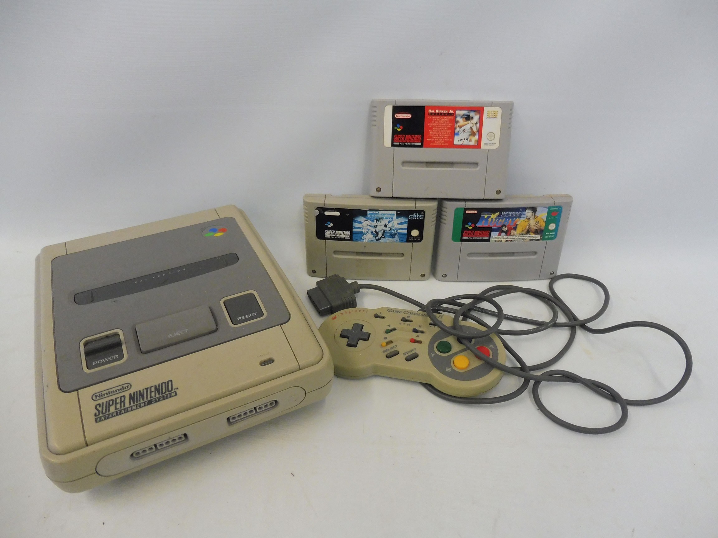 A Nintendo Super Nintendo games console with games (unchecked).