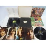 Two original The Beatles LPs: an original top loading white album no. 0402519 complete with four pin