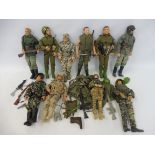 A quantity of Action Man figures, dragons and others, uniforms and accessories.