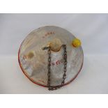 A hand made fairground flying saucer with hanging chain from a haunted house ride, made from two