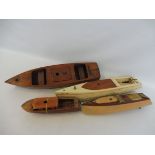 Four period wooden steam boats.