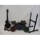 A PS2 drum kit and guitar.