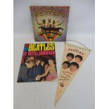 A rare Beatles hanging pennant showing the Beatles plus a copy of 'The Beatles by Royal Command' and