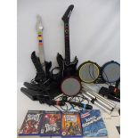 A Rockband Harmonix drum kit, a PS2 guitar, games etc.