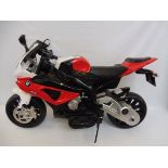 A battery operated model motorcycle, with charger.