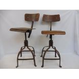 A pair of original circa 1950s industrial workshop chairs, swivel mechanism to adjust height,