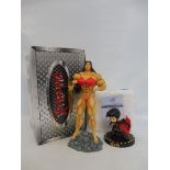 A boxed fantasy figure, with a boxed Elvis figure.