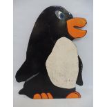 A hand painted fairground penguin from a hoopla type stall, circa 1970s, 24 x 18".