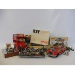 A box of miscellaneous tinplate, die-cast vehicles and lead/plastic figures.
