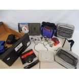 A box of gaming cases and accessories including Nintendo, Sony etc.