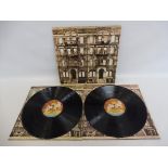 A Led Zeppelin Physical Graffiti on Swan Song label, vinyl appears in VG+ condition, cover in near
