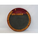 An unusual circular tin educational toy 'Unbreakable Spelling Board'.