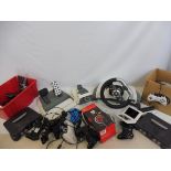 A Nintendo 3DS, a TX40 Stereo Gaming Headset and various controllers, Nintendo 64, Xbox steering