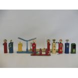 A collection of miniature die-cast model petrol pumps including many with original decals