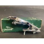 A small Jaguar 'leaper' car mascot in original box.