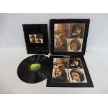 An Apple The Beatles 'Let It Be' LP box set with red apple logo on the rear of the sleeve and