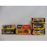 Five boxed Corgi Formula 1 racing cars and a boxed Ferrari 312 racing car.