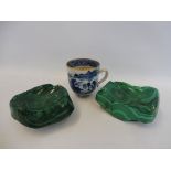 Two polished malachite dishes and a Chinese blue and white cup.