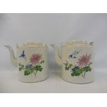 A pair of Chinese Canton teapots decorated with flowers and birds in flight, 7 3/4" high.