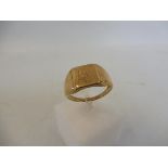 A cased 9ct gold signet ring.