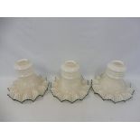 Three Edwardian milk glass shades with green edges wavy borders, by repute removed from