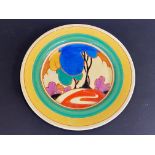 A Clarice Cliff 'Blue Autumn' patterned circular plate, hand painted with a stylised tree