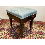 An Edwardian adjustable height piano stool.