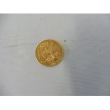 A gold sovereign dated 1909.