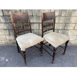 A pair of Arts and Crafts side chairs in the manner of Liberty.