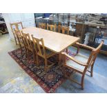 A light oak refectory table raised upon end supports, joined by a central stretcher, 84" long x 29