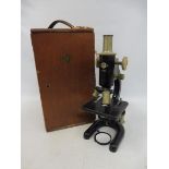 A cased Prior microscope.