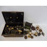 A tin of various old brass light switches, brass curtain rail fittings, lamp parts etc.