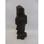 An unusual carved figure, possibly Native American, 8" high.