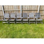 A set of six hardwood folding garden chairs with cushions.