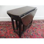 A rare 18th Century oak child's drop leaf table with single drawer on rectangular supports, 24" x