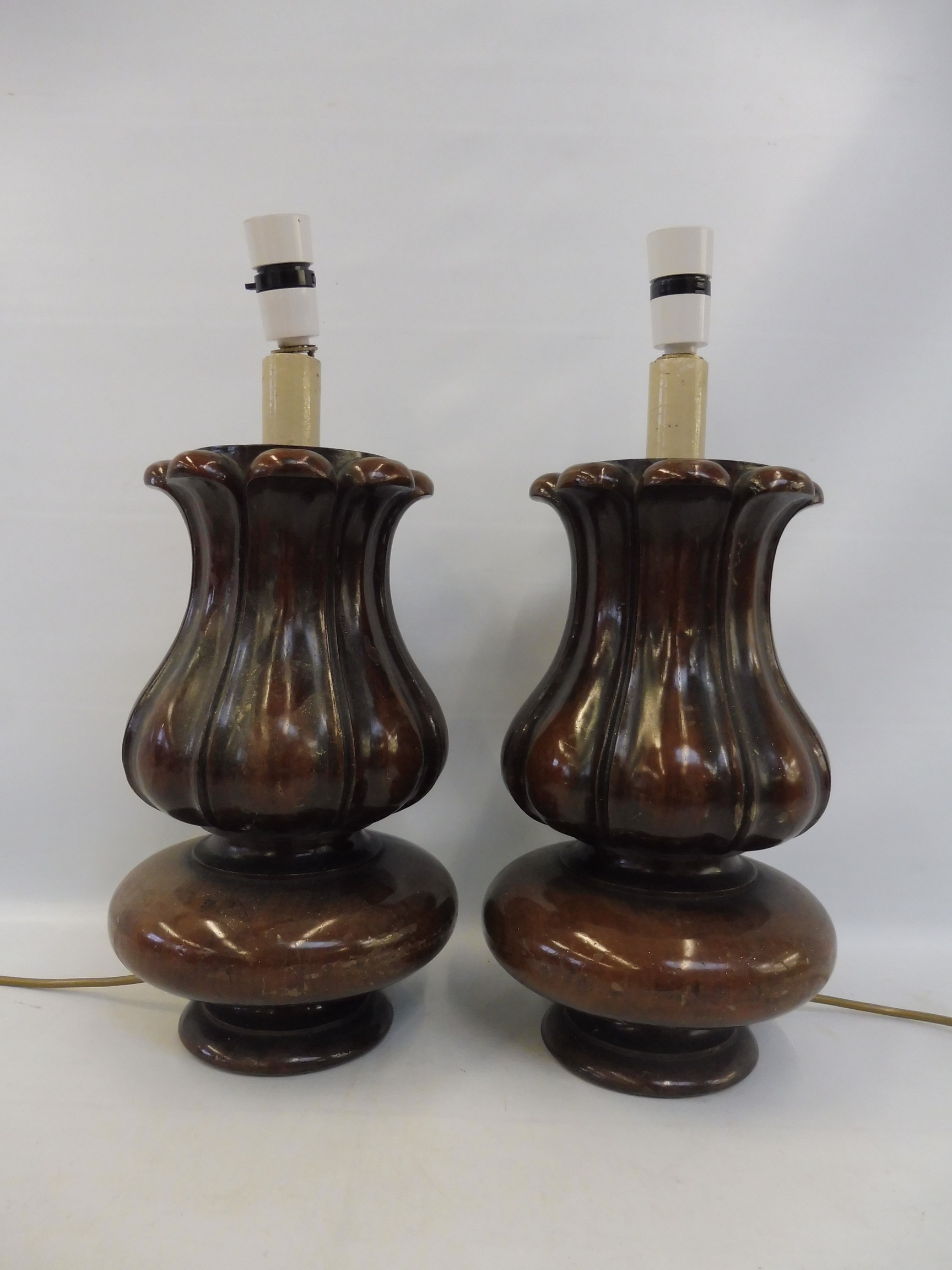 A pair of good quality mahogany bulbous fluted table lamps, each 12 1/2" tall excluding bulb