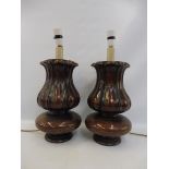 A pair of good quality mahogany bulbous fluted table lamps, each 12 1/2" tall excluding bulb