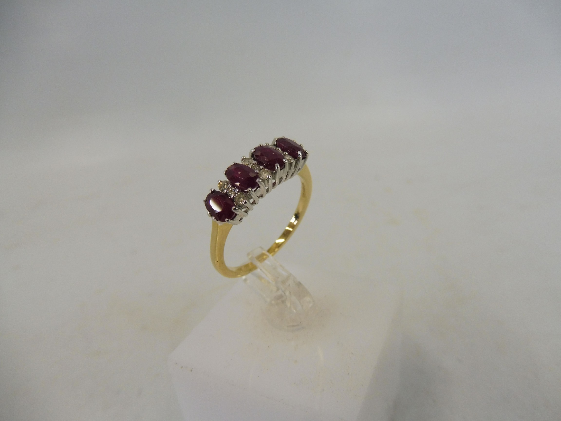 An 18ct gold and 1.12 diamond and ruby ring.