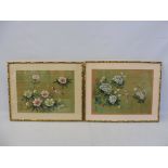 A pair of framed and glazed Chinese silks, decorated with flowers and birds, signed, each