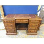 A Victorian mahogany twin pedestal leather topped writing desk, 54" wide x 31" high x 25" deep.