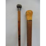 A silver topped walking cane, Birmingham 1912 and a malacca cane.