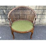 An Edwardian mahogany curved slat back bedroom chair of elegant form raised on cabriole supports.