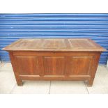 An 18th Century oak panelled coffer, in good condition, with a three panelled rising lid, 52 3/4"