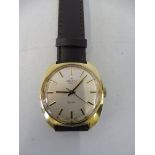 A gold plated Zenith wristwatch.