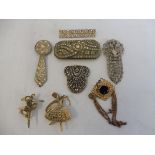 A quantity of decorative marcasite and other brooches.