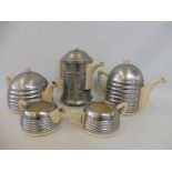 An Art Deco ceramic and metal covered part tea set.