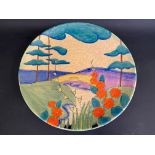 A large Crown Devon Fieldings Mattika circular charger, flowers in a landscape, numbered M306, 15