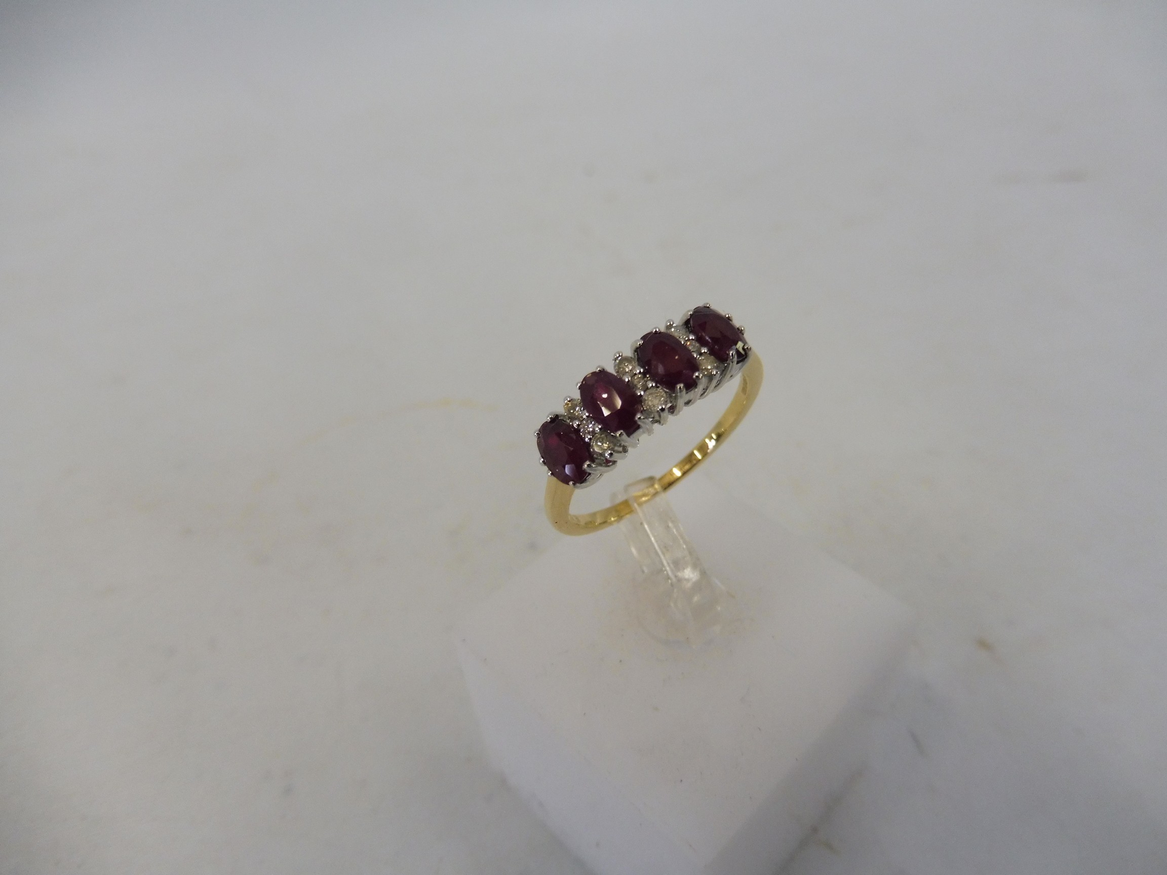 An 18ct gold and 1.12 diamond and ruby ring. - Image 4 of 4