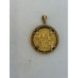 A gold sovereign, 1890, in a hanging mount.